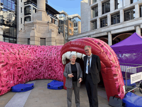 Master with lady outside gut exhibition 